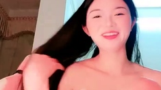 Naughty Japanese babe Ayaka Tomoda masturbates